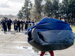 Refugee evicted carrying tent surrounded by police